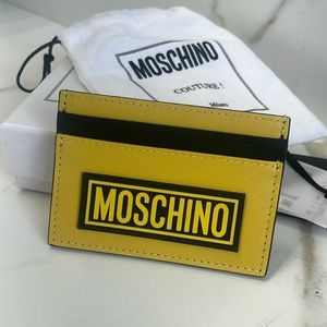 New in box. Moschino fantasy print yellow card holder